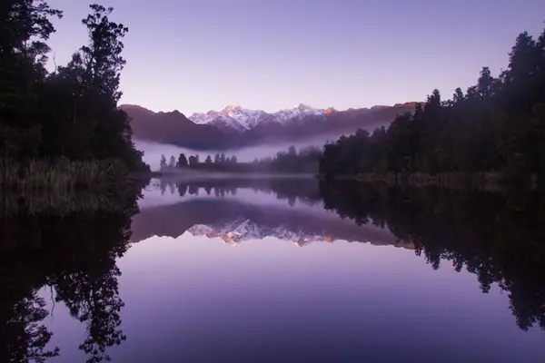 Morning Fog at Lake Matheson (Unsplash)